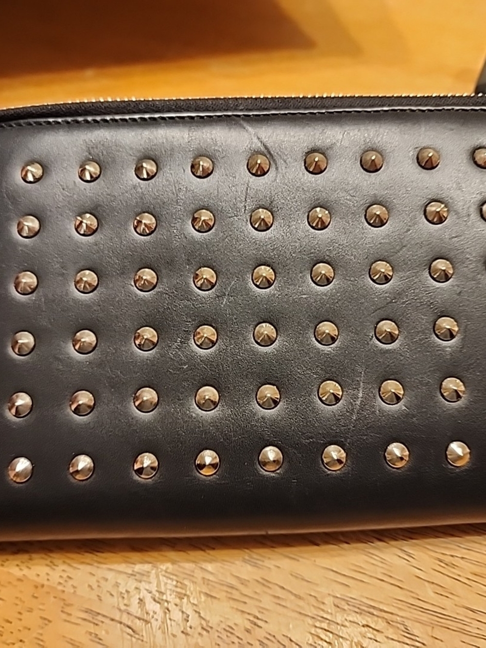Saint Laurent studded zip-around long wallet made of black leather